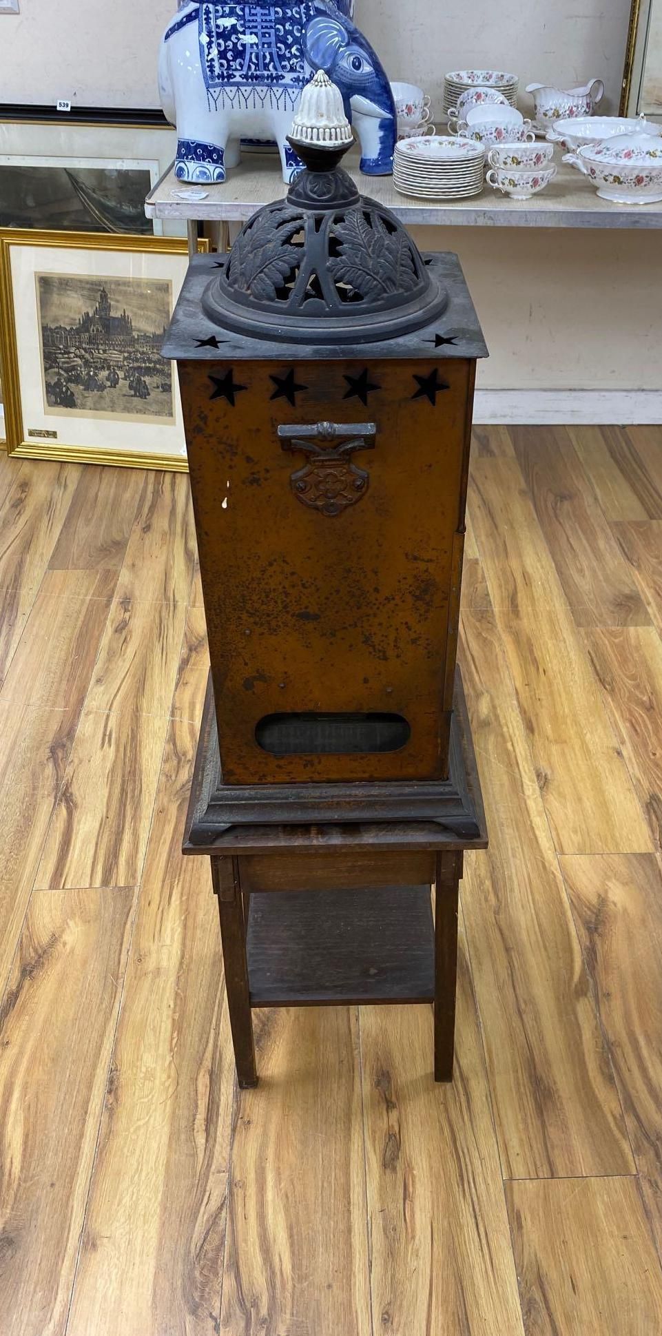 A Rippingilles Patent ABC Stove, Albion Lamp Co., oxidised copper frame, with leaded stained glass panel, circa 1860, 64cm high